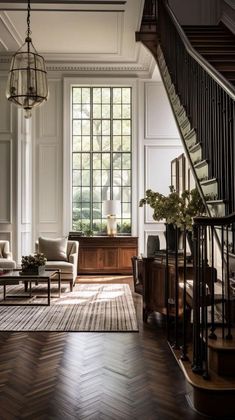 a living room filled with furniture and a stair case