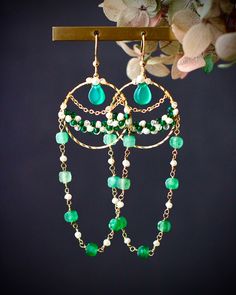 Made to order. Every item will come in a jewelry pouch for safety during travel and gift giving. These dangle earrings are handmade with all natural high quality and well selected gemstones. They are lightweight and comfortable to wear. All materials used are nickel free, friendly to sensitive skin.  🌷MEASUREMENTS Length: 8 cm including ear-wire Width: 2.5 cm 🌷GEMSTONE  🔹Emerald 🔹Green Chalcedony 🔹Green Strawberry Quartz  🔹Shell 🔹Glass Beads 🌷MATERIALS 🔹14K gold filled ear wire, 14K gold filled wrapping wire, 14K gold filled chain 🌷How to take care of my jewelry All handmade jewelry are made with delicate materials that must be handled with care. Please keep your jewelry away with chlorine, perfume, hairspray, soap, lotion or areas with high humidity. Welcome to follow my Instagr Gemstone Bead Earrings, Elegant Boutique, Green Jewellery, Handmade Dangle Earrings, Diy Jewelry Earrings, Green Strawberry, Crystal Chandelier Earrings, Interchangeable Jewelry