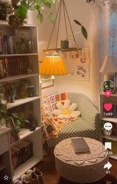 a living room filled with furniture and lots of books