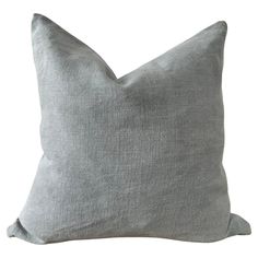 a gray pillow on a white background