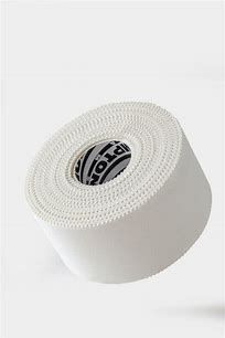 a roll of white gauze tape with black and white designs on it's side