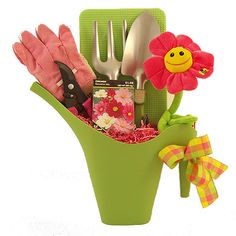 a flower pot filled with gardening utensils and other things to make it look like someones garden