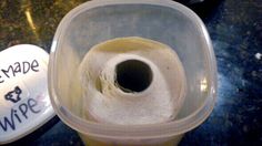 a roll of toilet paper in a plastic container