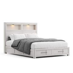 a white bed with drawers underneath it on a white floor and wall behind the headboard