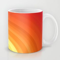 an orange and yellow coffee mug on a white background with the colors of the rainbow