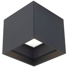 a black square light fixture on a white background, with the top half lit up