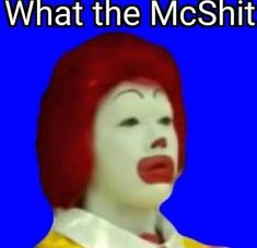 a woman with red hair and makeup is wearing a clown costume, text reads what the mcshit?