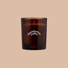 a glass candle with the words, ommephania's coffee on it