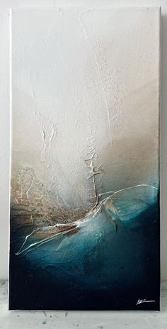 an abstract painting with white and blue colors on the canvas, it looks like something out of