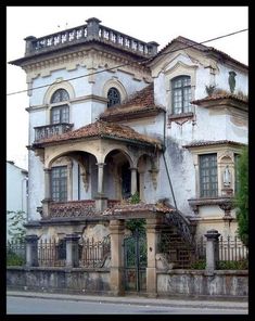 an old building with many windows and balconies