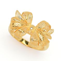 Perfect for the holiday season, this gleaming Lambert Cheng bold bow ring is ready to adorn your finger for the festivities. You'll love all of the compliments you receive! It's expertly crafted in 24K yellow gold with a brilliant polished finish. It's a perfect finishing touch to any favorite ensemble, whether you're going casual or dressing up. The adjustable band ensures a perfect fit. This ring is sure to be a go-to favorite in your collection. Elegant Christmas Gift Rings, Elegant Christmas Anniversary Rings, Elegant Gold Butterfly Ring For Anniversary, Round Bow Rings For Gift, Elegant Gold Butterfly Ring For Formal Occasions, Formal Bow Jewelry For Valentine's Day, Yellow Gold Jewelry With Decorative Bow For Party, Party Jewelry In Yellow Gold With Bow Detail, Luxury Bow Jewelry For Anniversary