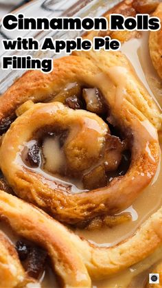 cinnamon rolls with apple pie filling in the middle on top of a baking sheet and text overlay that reads, cinnamon rolls with apple pie filling