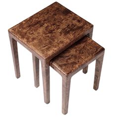 two small wooden tables sitting on top of each other