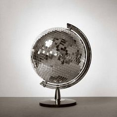 a disco ball sitting on top of a metal stand