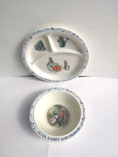 two plates with the words peter rabbit and friends painted on them are sitting next to each other