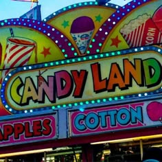 the candy land apple cotton sign is lit up