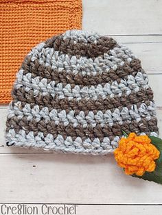 two crocheted hats sitting next to each other