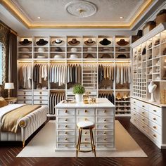 a walk in closet filled with lots of white drawers and shelves next to a bed