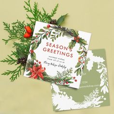 two christmas cards on top of each other with holly and red berries in the middle