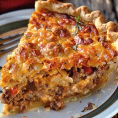 a slice of meat and cheese quiche on a plate