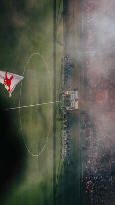 an aerial view of a soccer field with fans