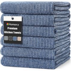 six blue kitchen towels stacked on top of each other with the tag hanging from them