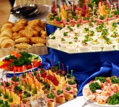 an assortment of appetizers and snacks on display at a party or wedding reception