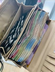 the inside of a purse filled with lots of papers