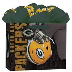 a green bay packers football helmet on top of a gift bag