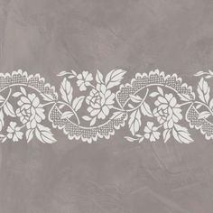 a white lace border with flowers and leaves on a light gray background, ready to be used as a wallpaper