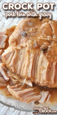 crock pot pork with gravy on a glass plate