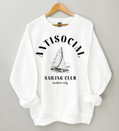 Antisocial sailing club members only sailboat and ocean print on front of sweatshirt. Great nautical coastal Christmas gift. Ideal for any situation, a unisex heavy blend crewneck sweatshirt is pure comfort. These garments are made from polyester and cotton. This combination helps designs come out looking fresh and beautiful. The collar is ribbed knit, so it retains its shape even after washing. There are no itchy side seams on these sweaters. ⚡️ 50% Cotton 50% Polyester ⚡️ Medium-heavy fabric ( Sailing Gifts, Nautical Sweater, Etsy Clothes, 90s Sweatshirt, Nautical Gifts, Club Sweatshirts, Coastal Christmas, Ocean Print, Members Only