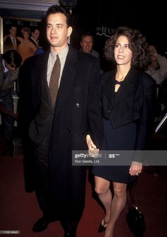 a man and woman walking together at an event