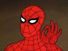 a spider - man with his hands in the air and eyes wide open, staring at something