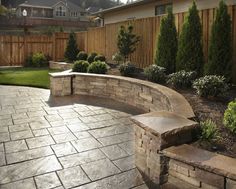 an outdoor patio with stone steps and landscaping