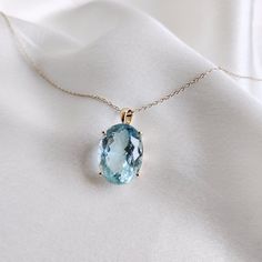 This stunning pendant is set in 14k Solid Yellow Gold with Natural Aquamarine with utmost precision. It is an unique gemstone Pendant for nearly every occasion and is completely hassle-free jewelry. ITEM DETAILS: * Gem: Aquamarine * Gem Size: 13X17mm * Gem Shape: Oval cut * Gem Weight: 13.18 carats * Gold Purity: 14KT * Gold Weight: 1.62 gram * Total Weight of the Pendant: 4.26 gram The Gold purity is guaranteed and it comes with authentic 14KT gold hallmark. Since my items are handmade, they ar Formal Oval Necklace With Large Stone, Oval Blue Topaz Birthstone Necklace, Elegant Oval Necklace With Large Stone, Elegant Sapphire Jewelry With Large Stone, Yellow Gold Oval Jewelry With Large Stone, Luxury 14k Gold Jewelry With Large Stone, Elegant Jewelry With Large Oval Stone, Oval Gemstone Necklace In 14k Gold, Elegant Oval Jewelry With Large Stone