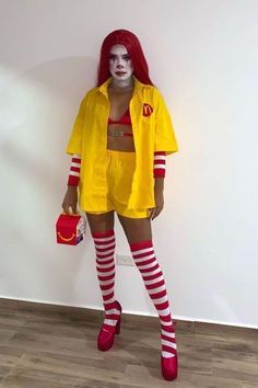 a woman with red hair and makeup is dressed up as a mcdonald's girl