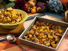 two pans filled with food sitting on top of a table