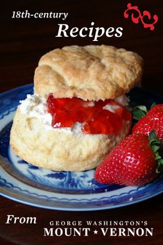 a strawberry shortcake on a blue and white plate with strawberries