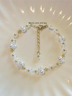 a bracelet with pearls and gold beads