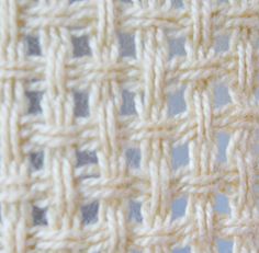 close up view of the crochet stitch pattern on a white cloth with blue background