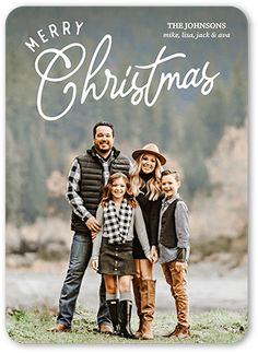 a holiday card with the words happy holidays written on it and two family members standing in front of a river