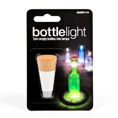 the bottle light is glowing green and has two small lights on each side of it