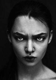 a black and white photo of a woman's face