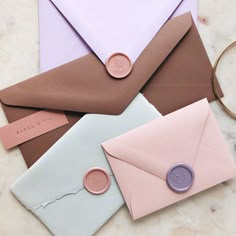 three envelopes with wax seals and some paper