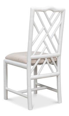 a white chair with a beige seat cushion