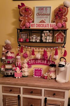 a buffet with hot chocolate bar decorations and gingerbread cookies on it's shelf