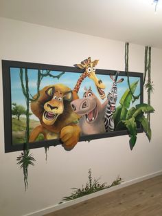 an animal mural on the wall in a children's room