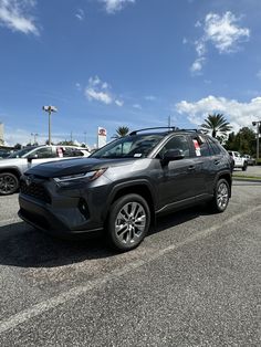 a gray toyota rav parked in a parking lot