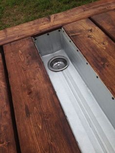 a dog bowl in the middle of a wooden deck